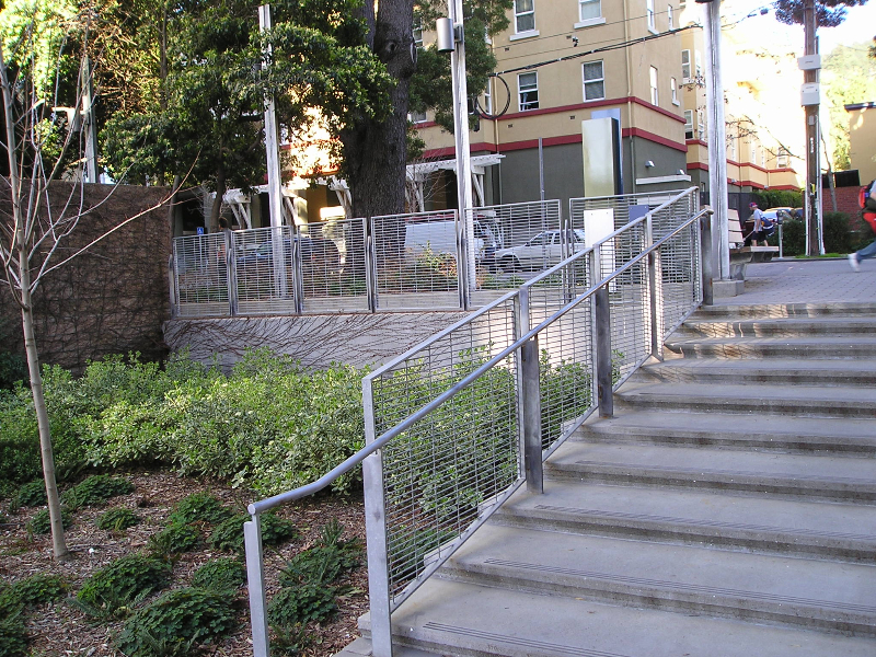 Galvanized handrail and infill guardrail along a set of campus steps